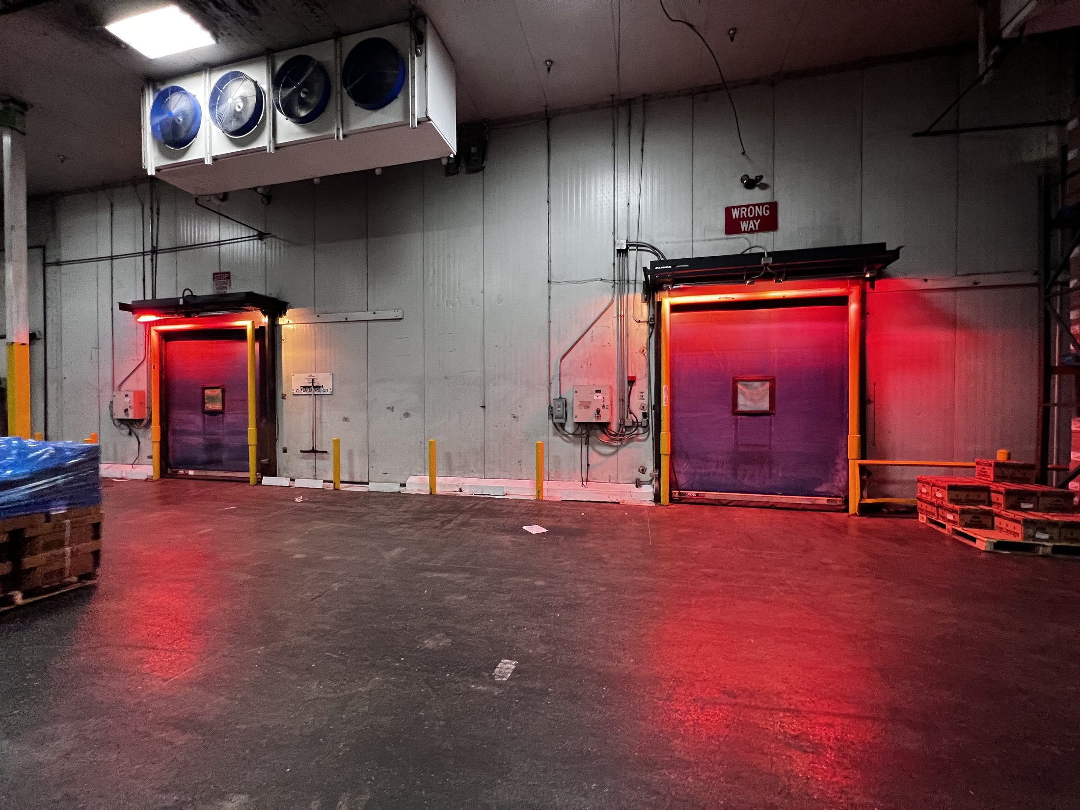 Cold storage facility doors under refrigeration equipment