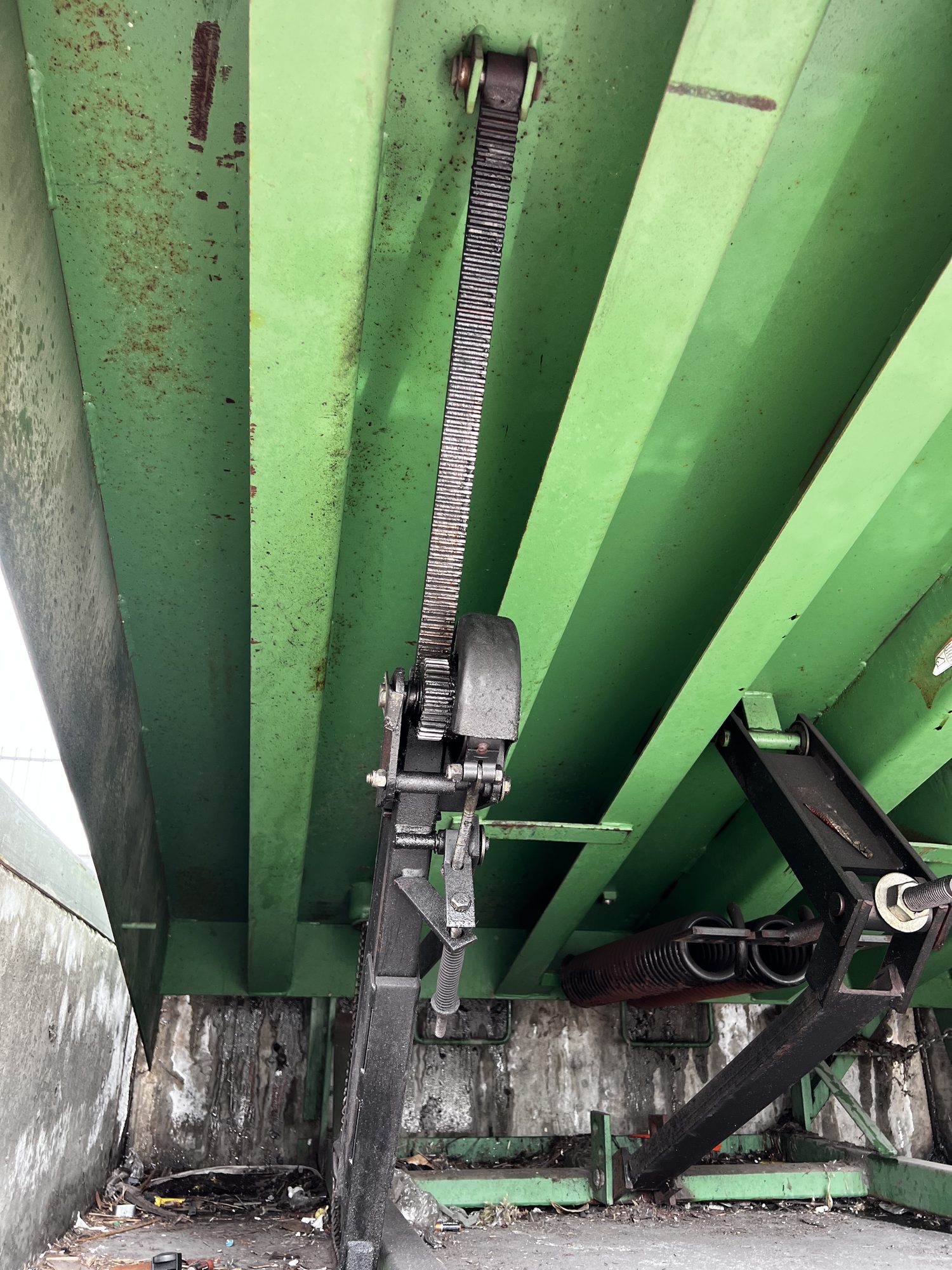 Mechanical dock equipment underneath a loading bay
