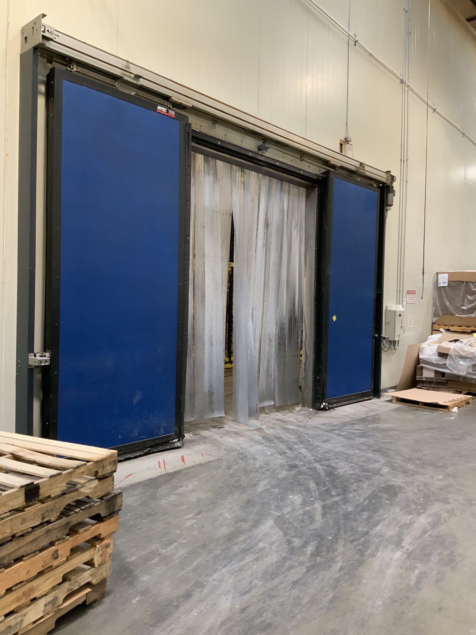 High-speed industrial door in a facility where reliability and cycling speed affect operations