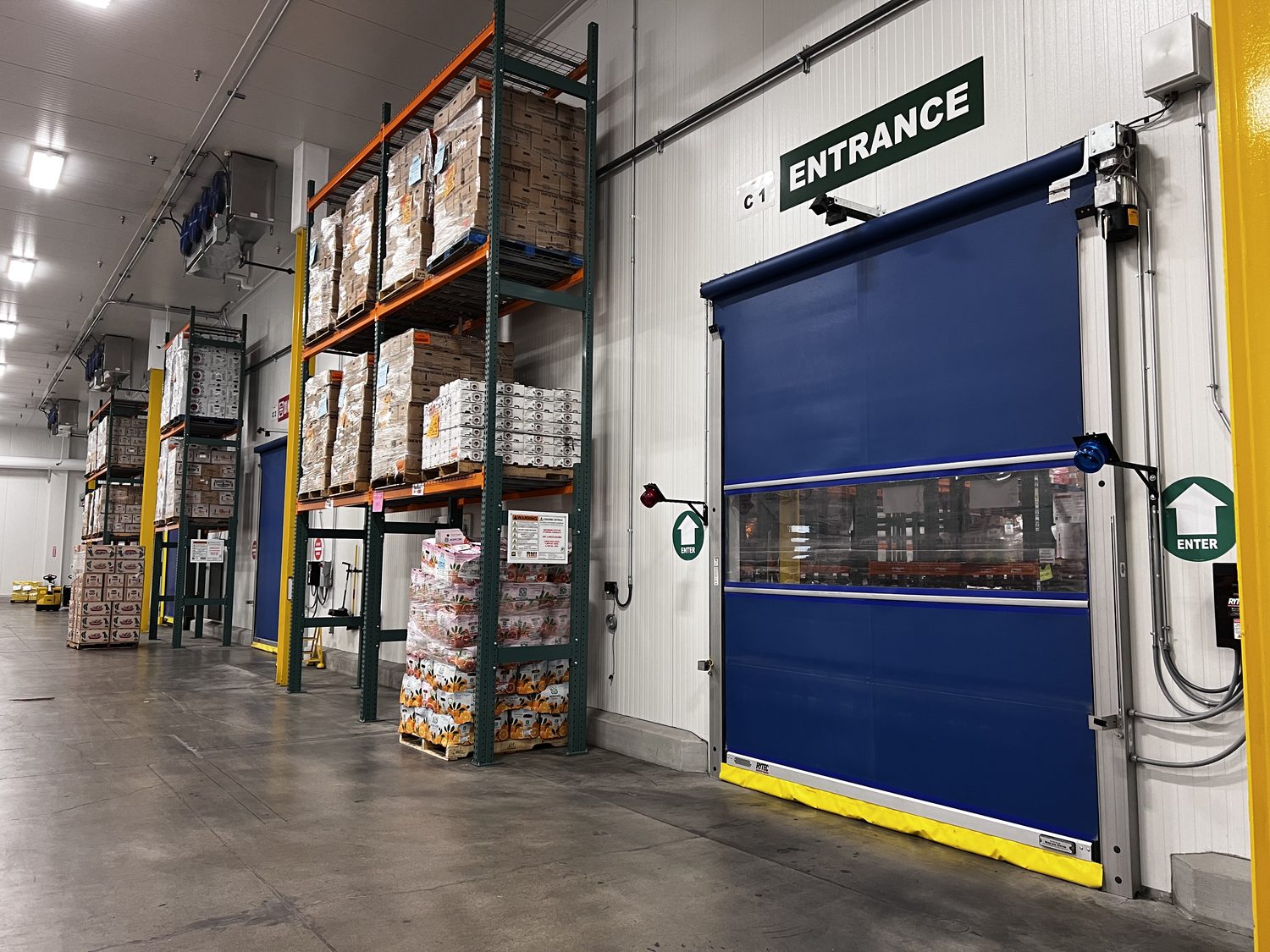 High-speed door in a warehouse aisle