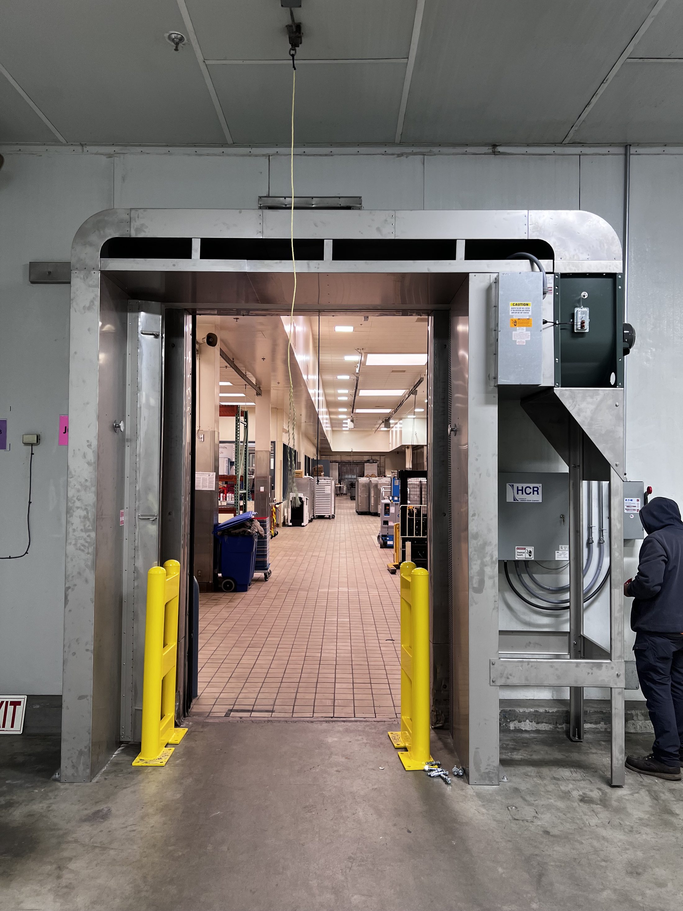 Industrial door opening in a manufacturing facility