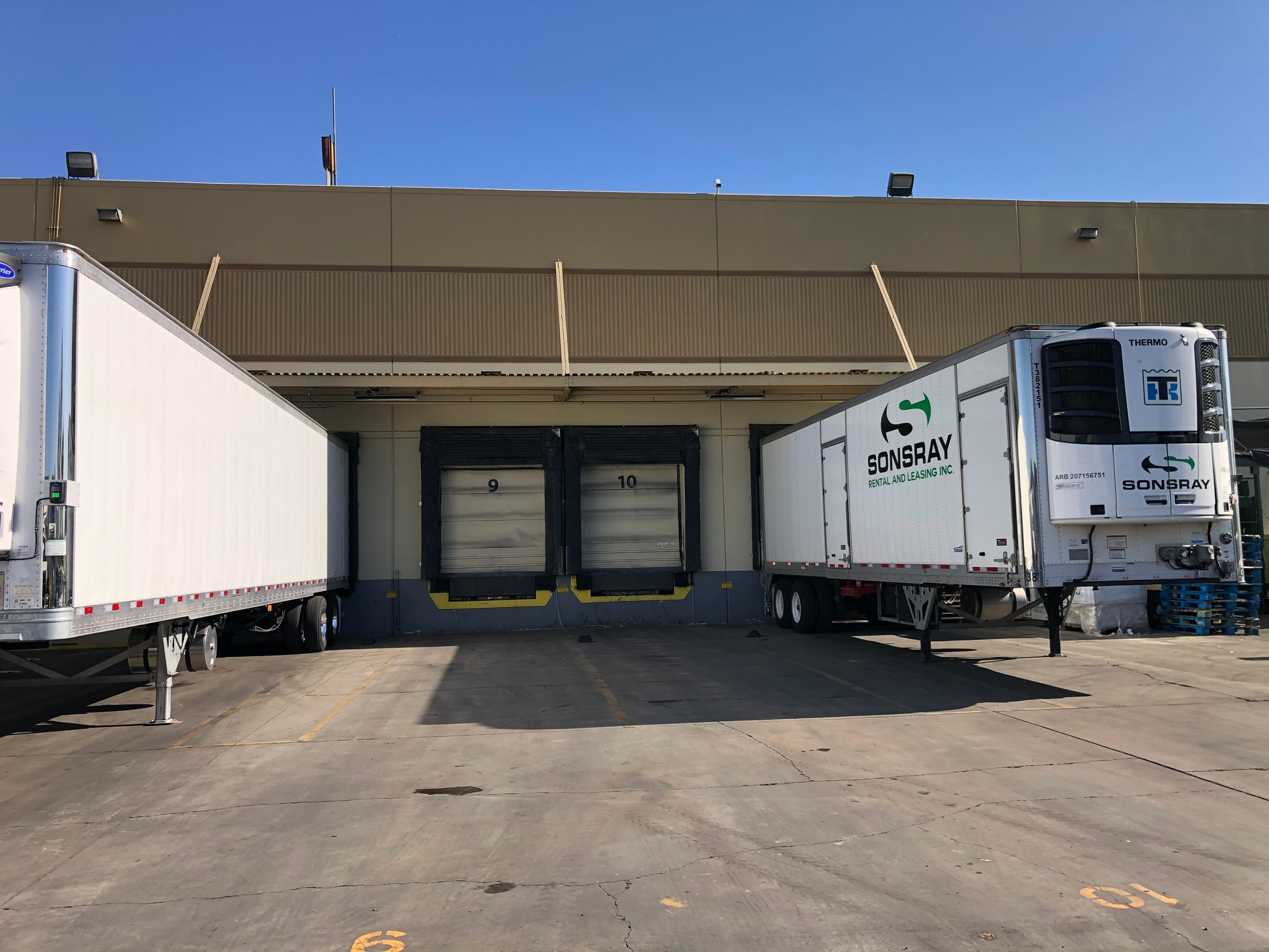Trailers positioned at loading dock bays at a Los Angeles County warehouse
