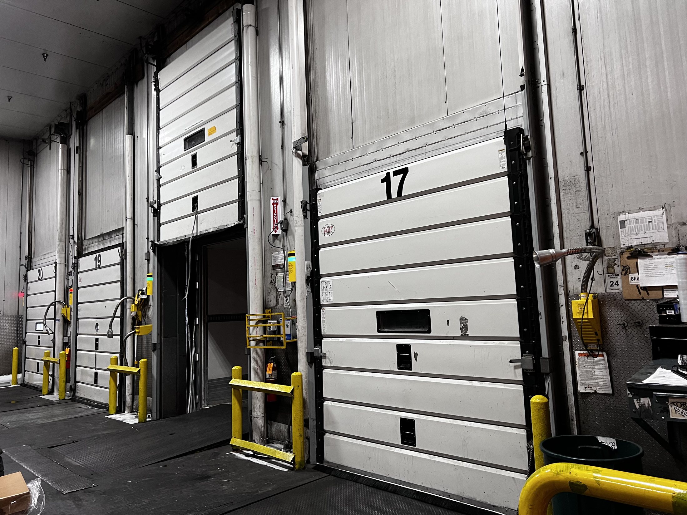 Commercial overhead door equipment in an industrial facility